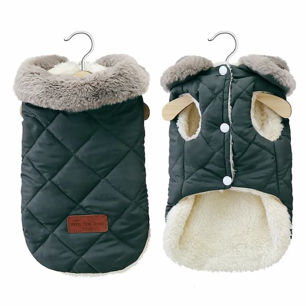 Two quilted dog coats with fur-lined hoods on hangers against a white background.