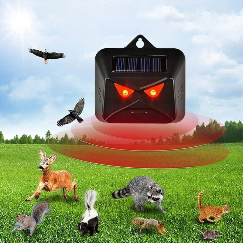 Solar-powered animal repeller with animals in a field