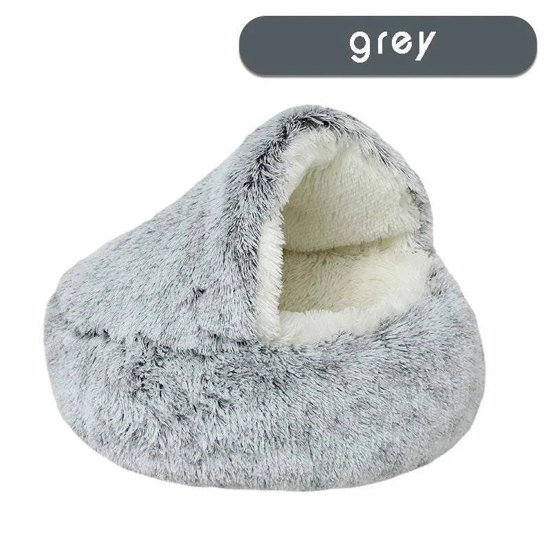 Cozy plush pet bed with a cat nestled inside, designed for small dogs and cats, featuring a soft, round sleeping nest with a cave-style opening.