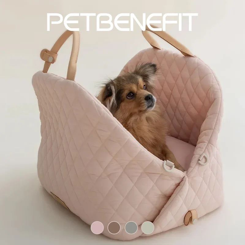 Dog sitting comfortably in luxury pet tote booster seat on a summer road trip