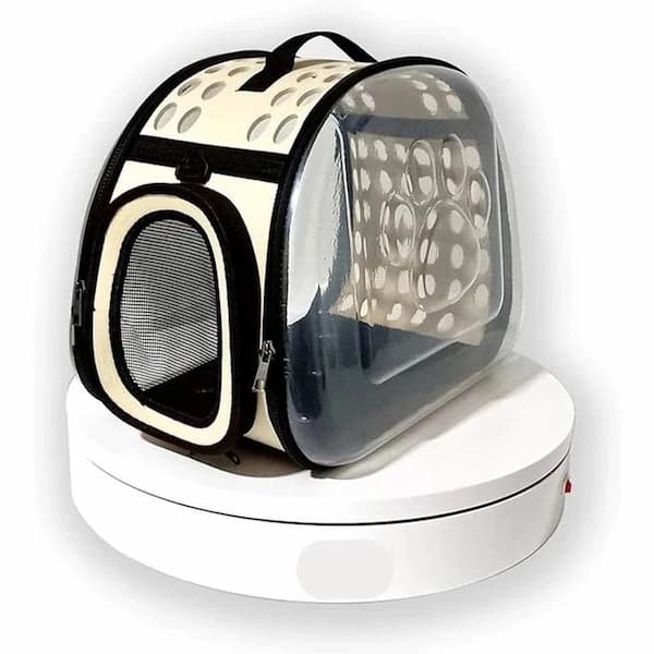 Pet carrier with polka dot interior on a white background