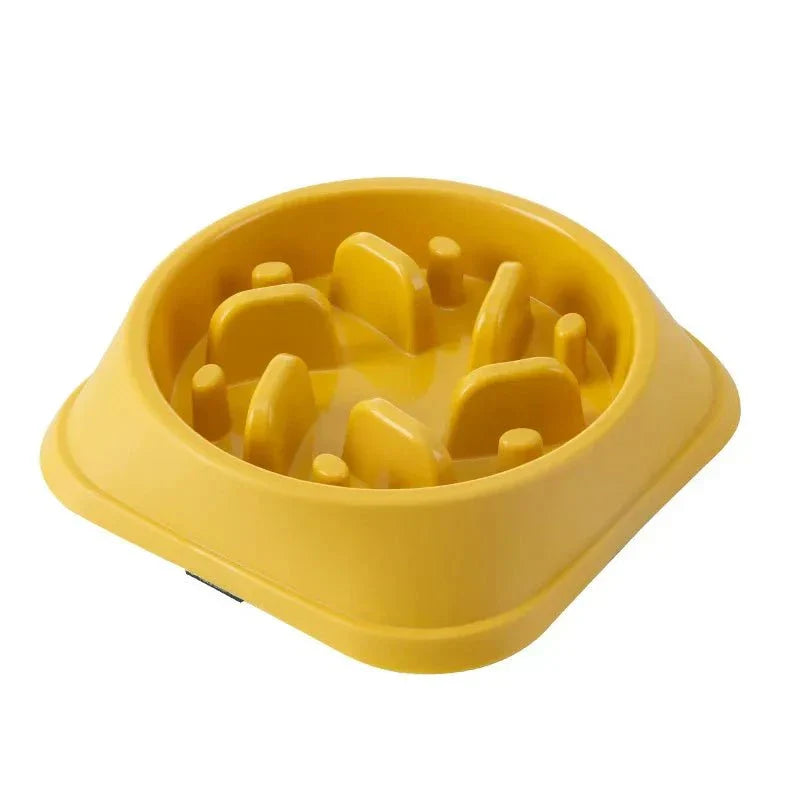 Anti-choking yellow slow feeding bowl for cats and dogs with non-slip base.