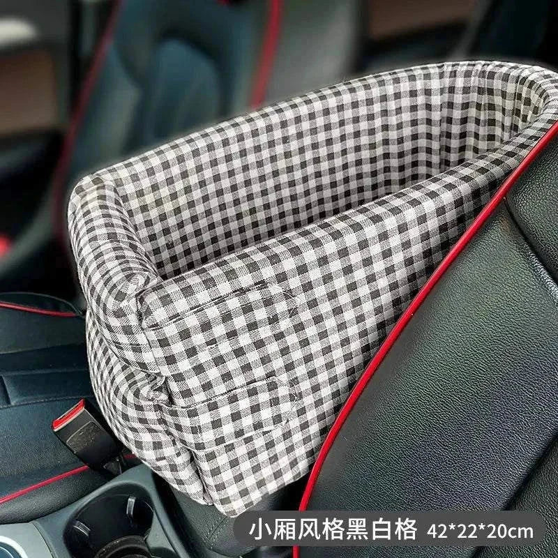 Portable dog car seat bed with checkered design for small dogs and cats, featuring a cushioned interior and adjustable straps for secure car travel.