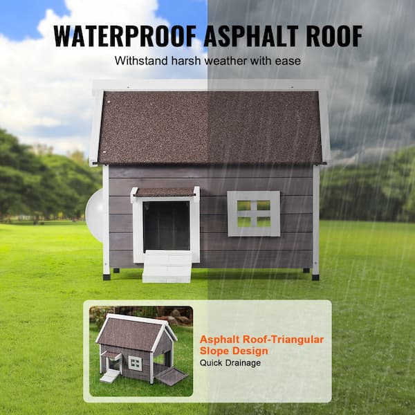 Premium cedar outdoor cat house with asphalt roof and escape door placed on grass – weatherproof wooden shelter for feral and outdoor cats.