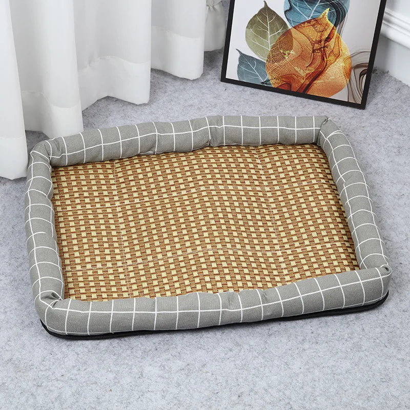 Woven pet bed with gray checkered border on a light gray floor.