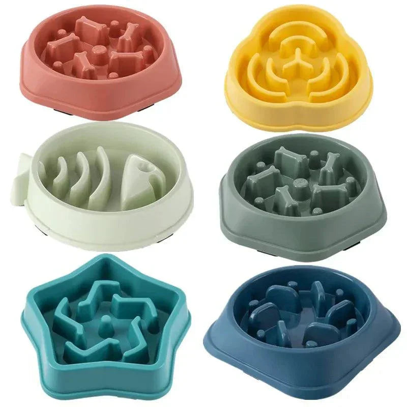 Slow feeding bowls for pets in various colors and shapes to promote healthy eating and prevent choking.