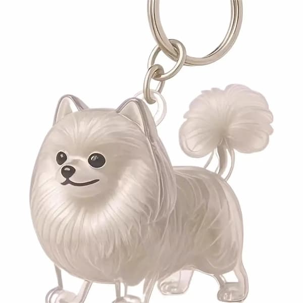 Keychain shaped like a white dog with a fluffy tail on a white background