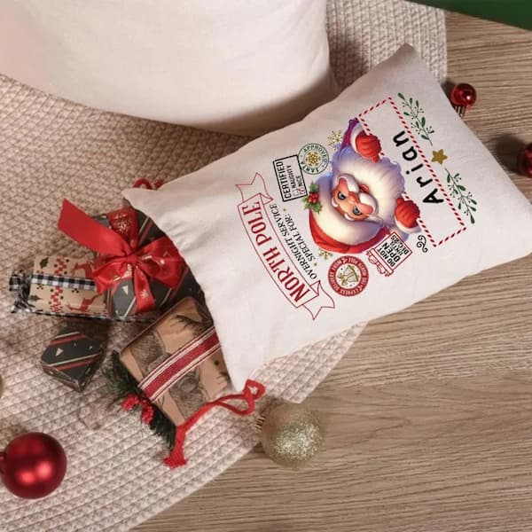 Decorative Santa bags with Santa Claus design on a wooden surface with Christmas ornaments.