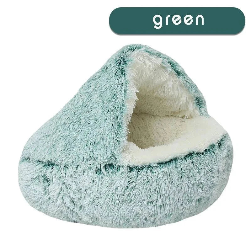 Cozy plush pet bed with a cat nestled inside, designed for small dogs and cats, featuring a soft, round sleeping nest with a cave-style opening.