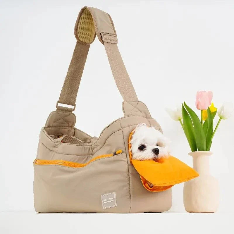 Cute pet carrier shoulder bag with small dog inside, featuring a stylish and functional design for travel.