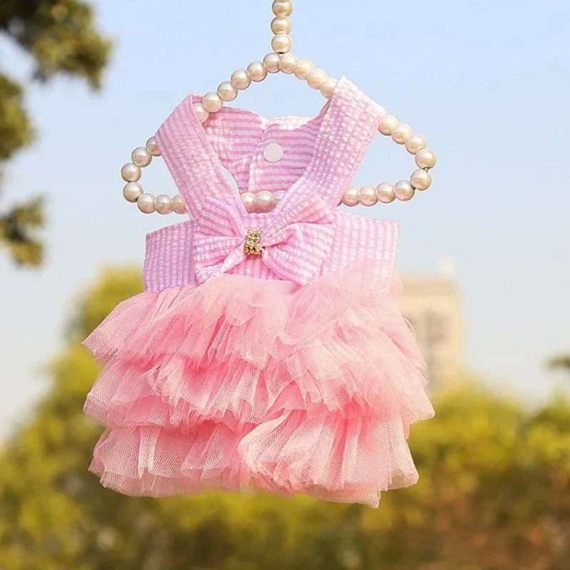 Pink lace skirt pet dress for small dogs and cats, perfect for summer wear.