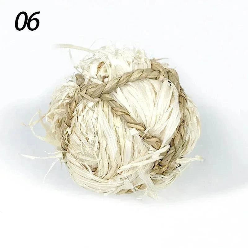 Braided natural grass chew ball for small pets, 7cm toy for guinea pigs, rabbits, and hamsters.