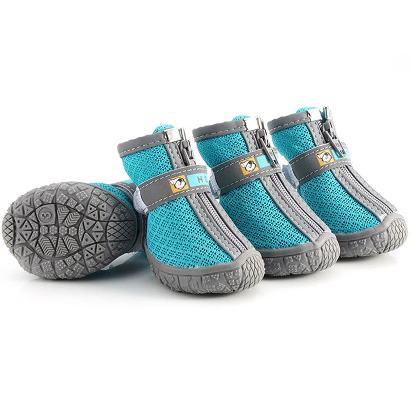 Pair of turquoise and gray pet boots on a white background