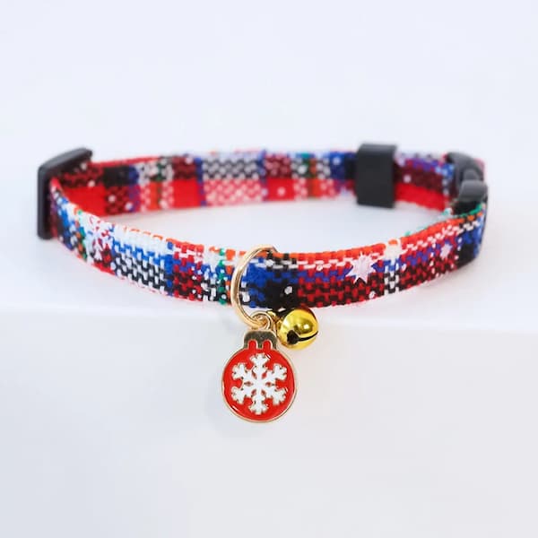 Colorful patterned cat collar with a snowflake charm on a white background