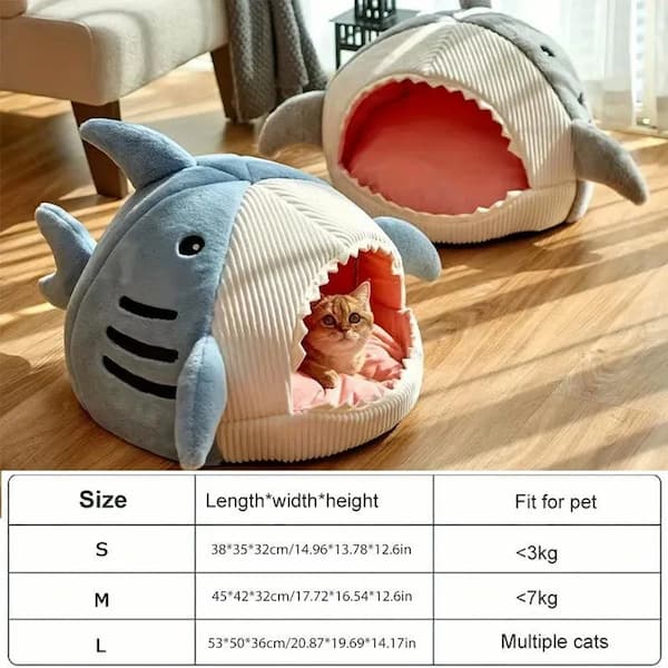 Shark-shaped pet bed with a cat inside on a wooden floor, accompanied by size chart.