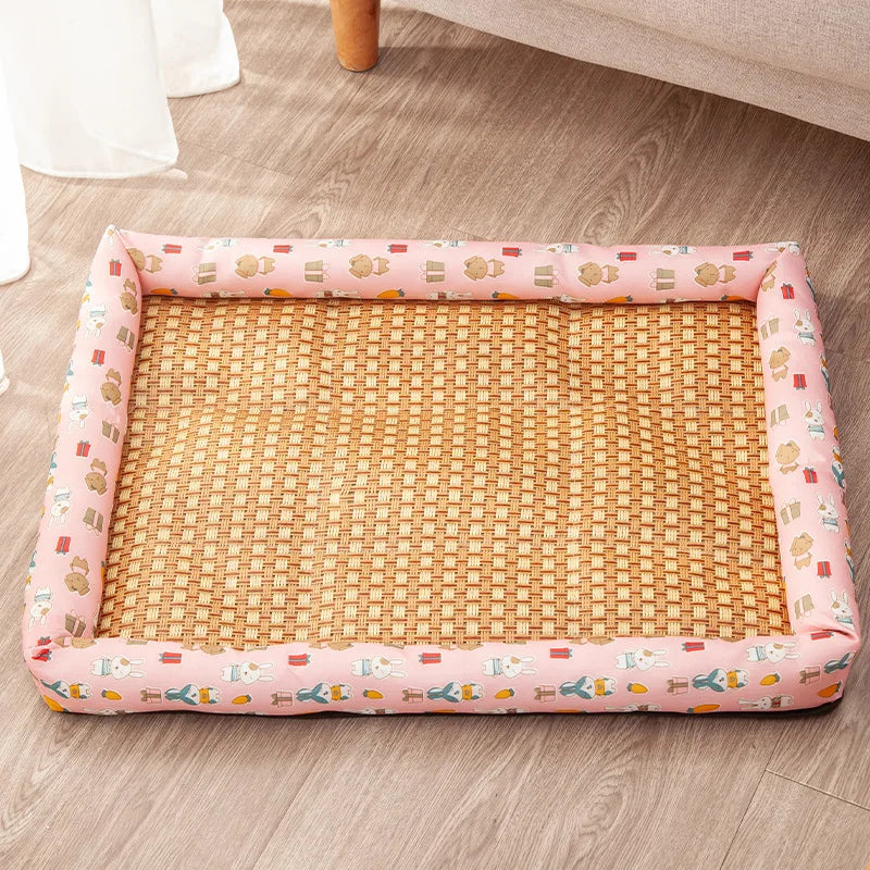 Woven pet bed with pink border on a wooden floor