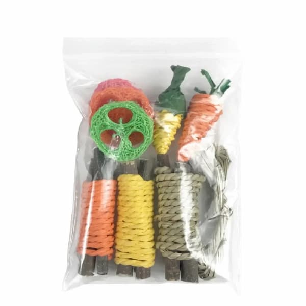 Assorted pet chew toys in a clear plastic bag on a white background