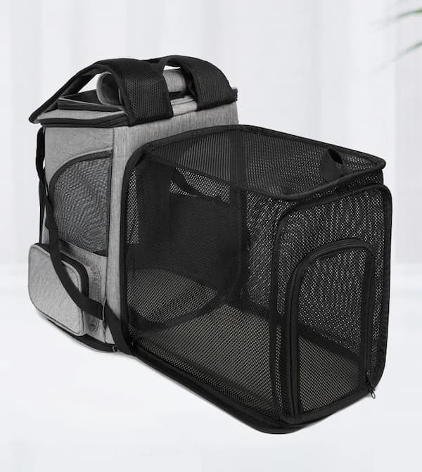 Pet carrier with mesh sides on a white background