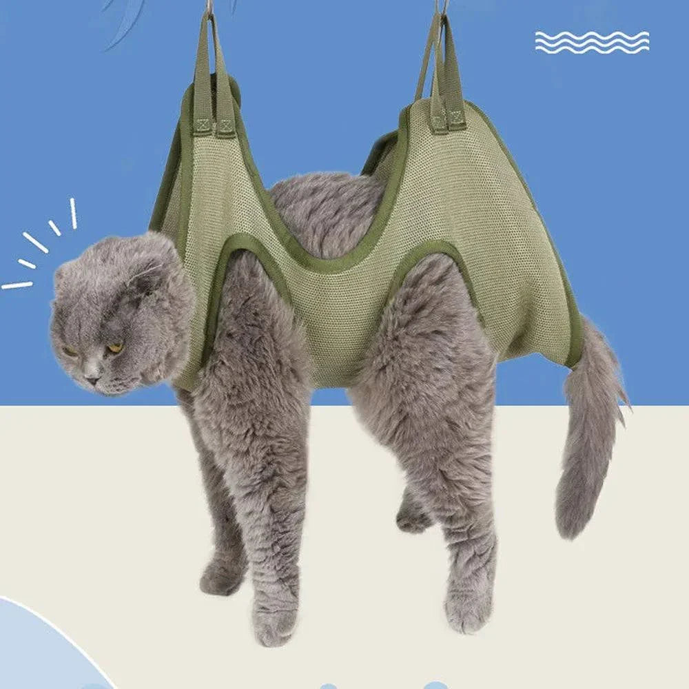 Gray cat comfortably lounging in a green grooming hammock designed with breathable fabric and secure hanging loops.