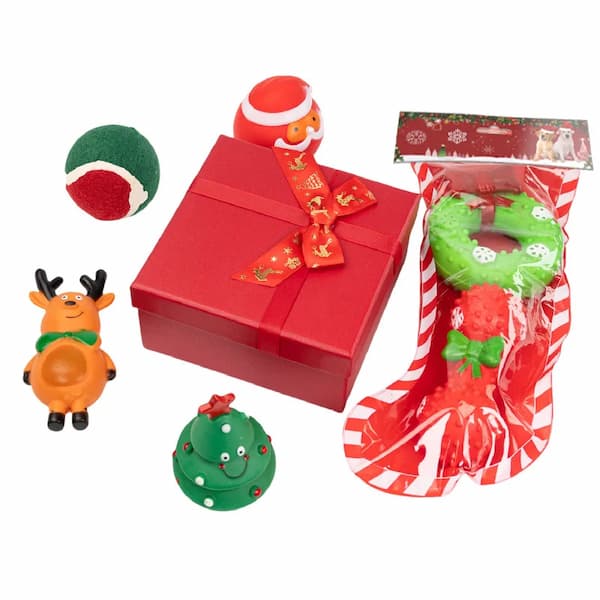 Collection of Christmas-themed toys and a gift box on a white background