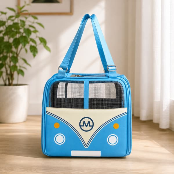 Blue Adventure Bus pet carrier with breathable mesh panels and comfortable shoulder straps displayed in a bright modern home, suitable for cats and small dogs up to 10kg.