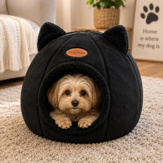 Small dog relaxing inside a black cozy cave pet bed with soft plush fabric and enclosed design for warmth comfort and security