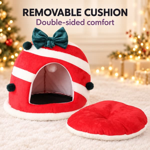 Red and white Christmas cat cave bed with green bow, shown beside its removable double-sided plush cushion.