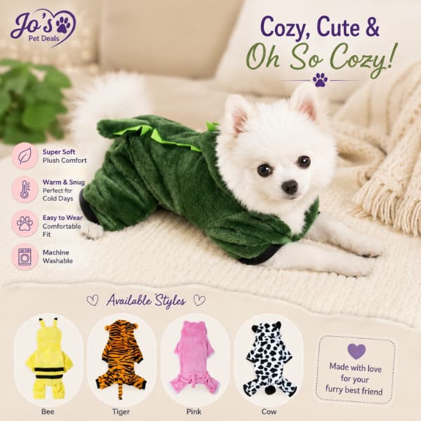 Small fluffy dog wearing a soft green dinosaur onesie with cozy winter pet pajama styles for small dogs