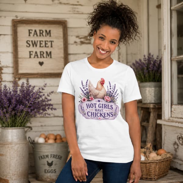 Farmhouse chicken lover t-shirt featuring the Hot Girls Have Chickens design displayed in a rustic country setting with lavender and fresh eggs.