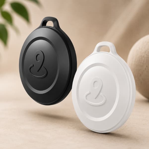 Premium Mini GPS Pet Tracker available in black and white, compatible with Apple Find My for dogs, cats, keys, luggage and everyday valuables.