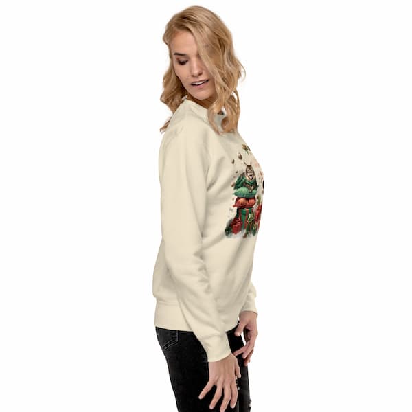 Woman wearing a cream hoodie with a graphic design on the back against a white background