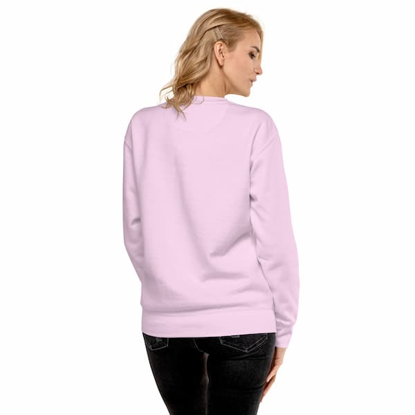 Person wearing a light pink sweatshirt on a white background