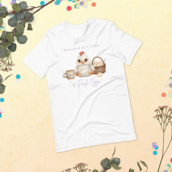 Powered by Coffee and Fresh Eggs chicken lover t-shirt flat lay with cute chicken illustration