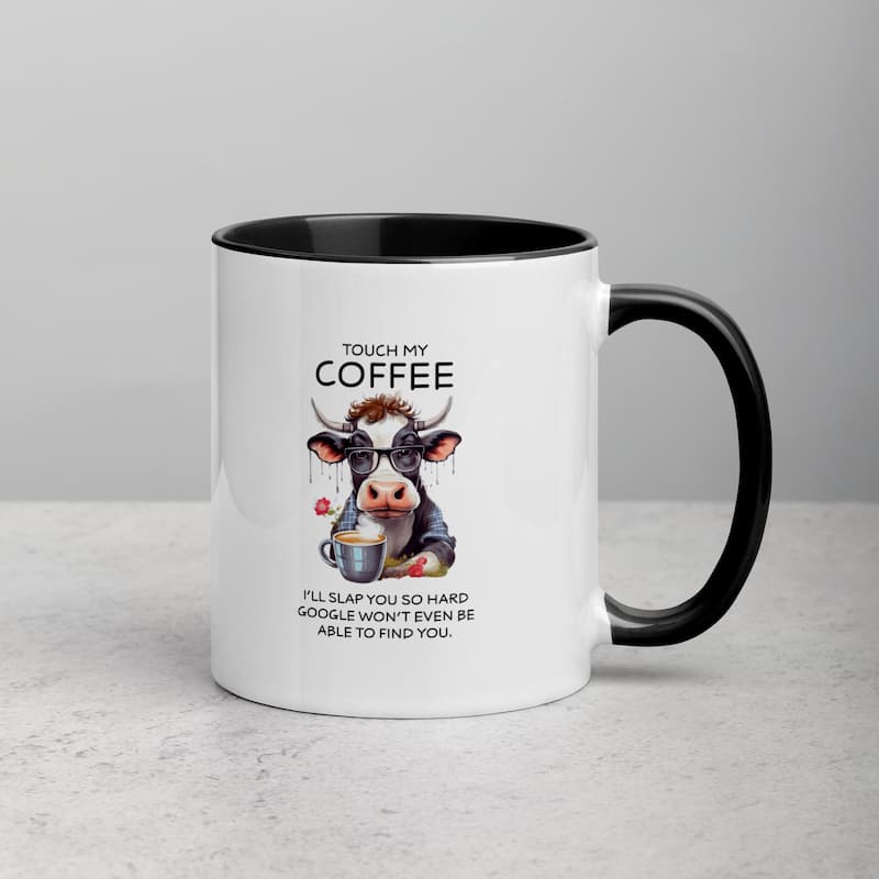 White ceramic mug with black handle featuring a funny cow illustration, glasses, and coffee cup with the quote 'Touch My Coffee – I’ll slap you so hard Google won’t even be able to find you'.