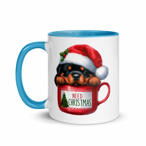 Festive Christmas mug featuring a cute Rottweiler puppy in a Santa hat inside a red cup with Christmas tree design – perfect holiday gift for dog lovers.