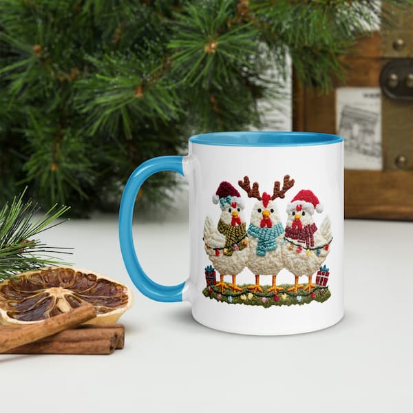 Mug with Christmas-themed design of chickens in sweaters and hats on a white surface with decorative elements.