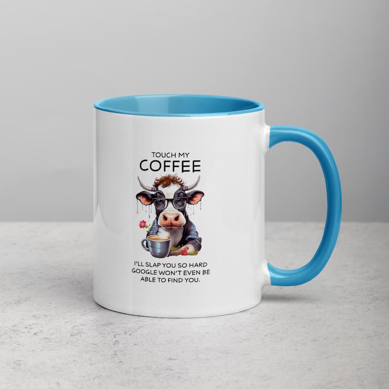 White ceramic mug with black handle featuring a funny cow illustration, glasses, and coffee cup with the quote 'Touch My Coffee – I’ll slap you so hard Google won’t even be able to find you'.