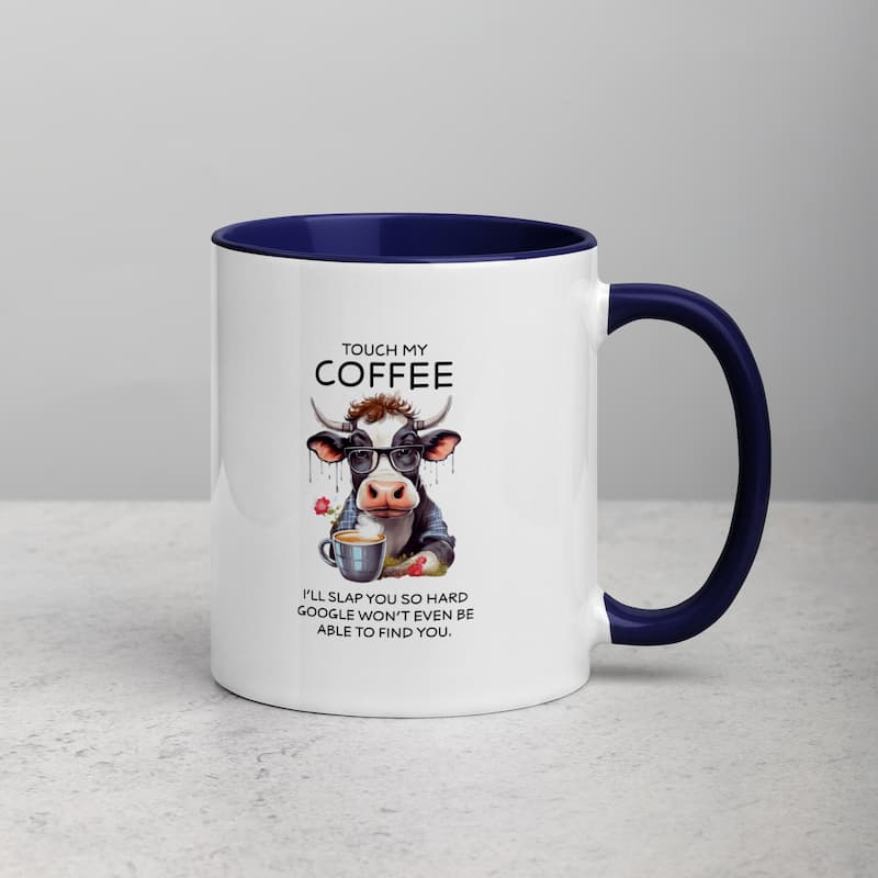 White ceramic mug with black handle featuring a funny cow illustration, glasses, and coffee cup with the quote 'Touch My Coffee – I’ll slap you so hard Google won’t even be able to find you'.