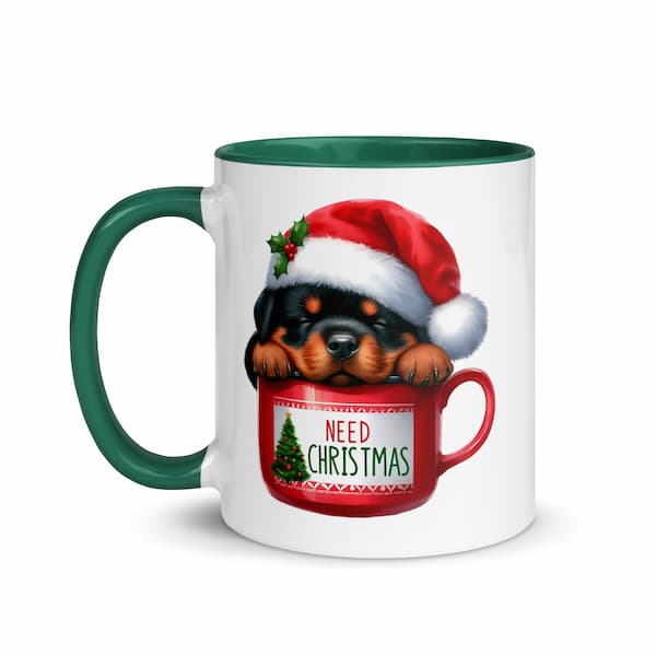 Festive Christmas mug featuring a cute Rottweiler puppy in a Santa hat inside a red cup with Christmas tree design – perfect holiday gift for dog lovers.