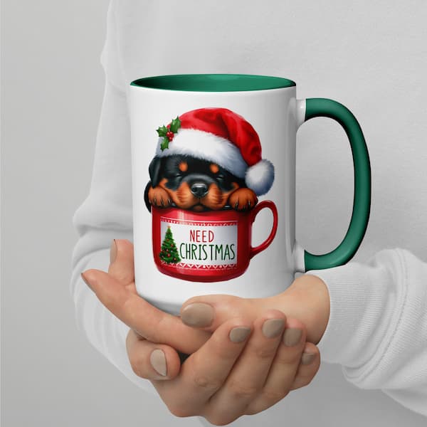 Festive Christmas mug featuring a cute Rottweiler puppy in a Santa hat inside a red cup with Christmas tree design – perfect holiday gift for dog lovers.