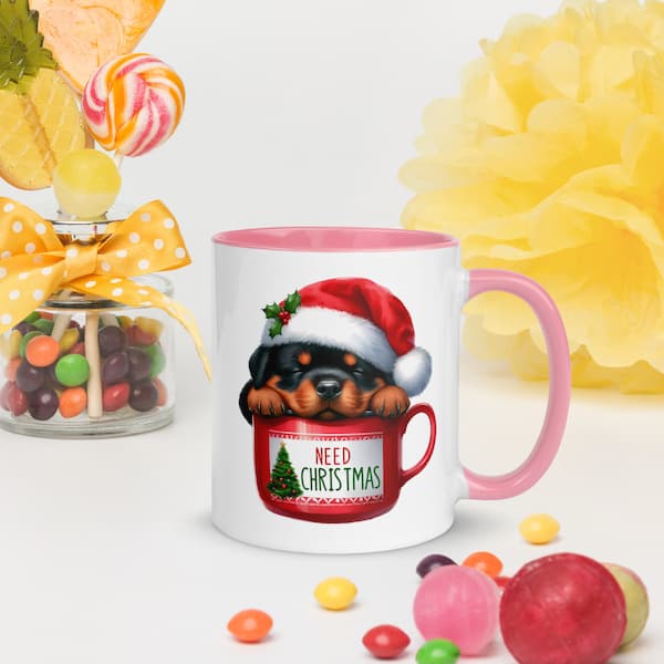 Festive Christmas mug featuring a cute Rottweiler puppy in a Santa hat inside a red cup with Christmas tree design – perfect holiday gift for dog lovers.