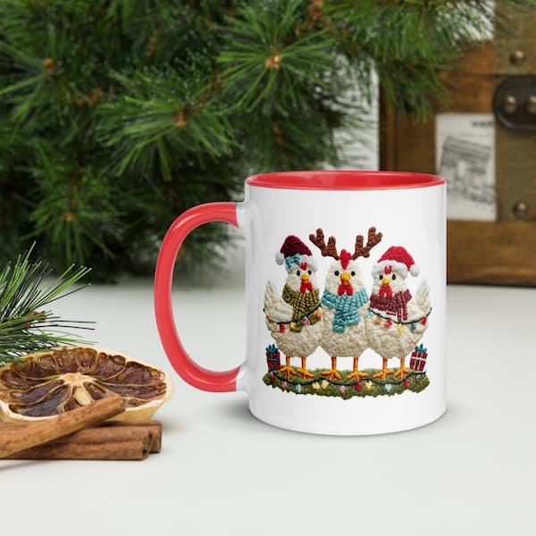 Mug with Christmas-themed design of chickens in sweaters and hats on a white surface with decorative elements.