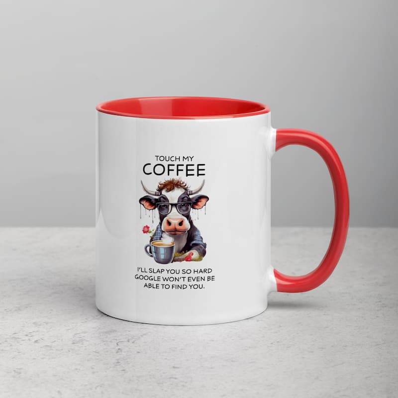 White ceramic mug with black handle featuring a funny cow illustration, glasses, and coffee cup with the quote 'Touch My Coffee – I’ll slap you so hard Google won’t even be able to find you'.