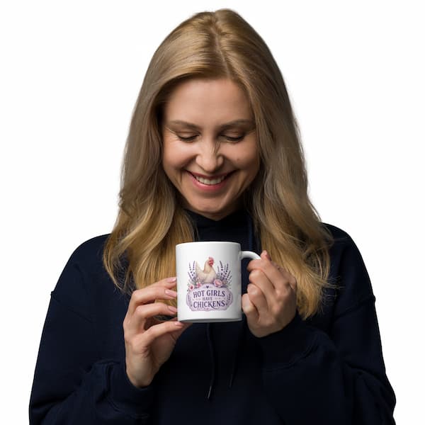 Hot Girls Have Chickens mug featuring a lavender farmhouse chicken design with floral accents on a white ceramic coffee cup.