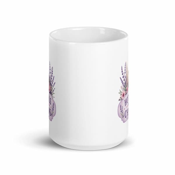 White mug with floral designs and text on a white background