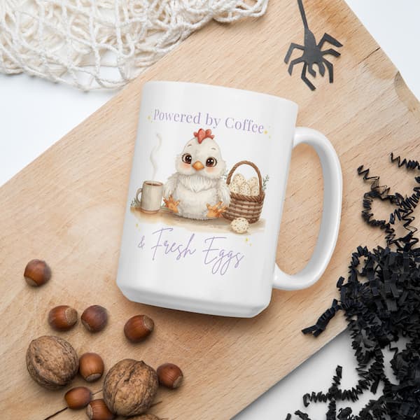 Cute chicken lover coffee mug with “Powered by Coffee & Fresh Eggs” design featuring an adorable hen, coffee cup and egg basket on a white ceramic mug.